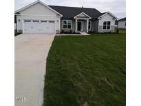 Two-story house with a two-car garage and nicely landscaped lawn at 1529 Pecan Drive Dr # 32, Nashville, NC 27856