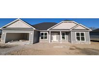 Gray siding two-story house with a stone accent and a large front yard at 662 Sweet Potato Lane Ln # 35, Nashville, NC 27856