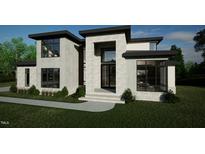 Contemporary home boasting a stone facade, black trim windows, and professional landscaping at 216 Dartmouth Rd, Raleigh, NC 27609
