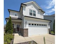 Charming two-story home featuring a two-car garage, light gray siding, and well-maintained landscaping at 2117 Attend Xing, Fuquay Varina, NC 27526