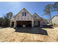 New construction home featuring a Craftsman-style exterior with an attached two-car garage and a charming covered front porch at 104 Roma Gora Ct, Princeton, NC 27569