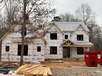 Two-story house under construction with gray roof and brick accents at 1062 Cabin Crk, Pittsboro, NC 27312