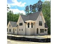 Striking exterior elevation featuring a neutral color palette and architectural detailing at 3341 Colby Chase Dr, Apex, NC 27539