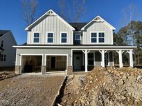 Two-story home with gray siding, white trim, and a two-car garage at 317 Highland Ridge Ln, Knightdale, NC 27545