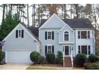 Two-story house with gray siding, white trim, and a two-car garage at 5205 Longwood Dr, Durham, NC 27713
