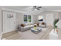 Bright living room features hardwood floors, recessed lighting and a large window at 8201 Rhodes Rd, Apex, NC 27539