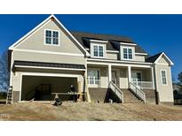Beautiful new construction home with two-car garage and welcoming front porch at 1233 Azalea Garden Cir, Raleigh, NC 27603