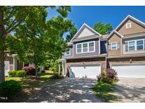 Beautiful townhome with attached garage, driveway, and landscaped front yard at 809 Davidson Point Rd, Cary, NC 27513