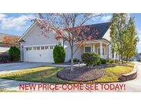 Charming home featuring a two-car garage, manicured landscaping, and mature trees in a desirable neighborhood at 219 Rosedale Creek Dr, Durham, NC 27703