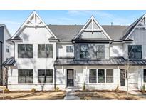 Charming new construction home featuring a modern design, black trim windows, and manicured landscaping at 324 Church St, Morrisville, NC 27560