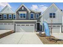 Two story home featuring a two-car garage, light gray siding, and a 'self tour' sign at 622 Brittany Ct, Durham, NC 27703