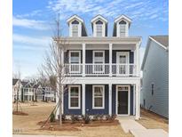 Charming two-story home with a front porch and classic architectural details at 672 Georgia'S Landing Pkwy # 69, Raleigh, NC 27603