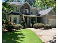 Two-story house with stone accents and landscaping at 1620 Dunn Rd, Raleigh, NC 27614