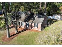 Charming single-story brick home featuring a classic design and well-maintained landscaping at 3540 Chelsea Dr, Rocky Mount, NC 27803