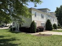 Charming townhouse with well-manicured landscaping and inviting front entrance at 526 Elm Ave, Wake Forest, NC 27587