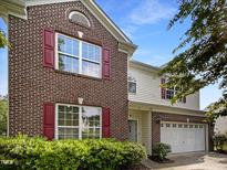 Charming two-story brick home with red shutters and a well-maintained front yard at 6 Heatherford Ct, Durham, NC 27704