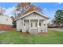 Charming craftsman home with gray siding, front porch, and landscaped lawn at 923 Belvedere St, Rocky Mount, NC 27803