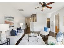 Inviting living room features neutral tones, plush seating, and a cozy ambiance at 8204 Yaxley Hall Dr, Raleigh, NC 27616