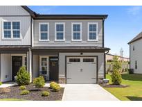 Charming home featuring a one-car garage, well-maintained landscaping, and a welcoming front entrance at 709 Jamescroft Way, Rolesville, NC 27587