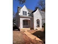 Charming new construction home featuring light-colored brick and siding at 3302.5 Hall Pl, Raleigh, NC 27607