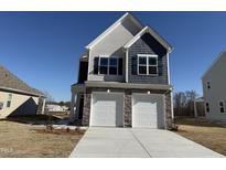 Charming two-story home with a two-car garage and stone accents at 350 Tormore, Homesite 126, Sanford, NC 27330