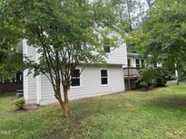 View of the two-story home with a landscaped yard, featuring a charming and well-maintained exterior at 1017 Gaston Ave, Durham, NC 27707