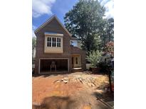 New brick home exterior with an attached garage and unfinished yard under a sunny, cloudy sky at 3302 Hall Pl, Raleigh, NC 27607