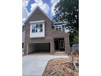 Beautiful new construction home boasts a stylish brick exterior, attached garage and classic design at 3302 Hall Pl, Raleigh, NC 27607