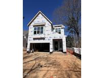 New construction home featuring a two-story frame with large windows at 3302 Hall Pl, Raleigh, NC 27607