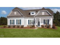 Craftsman style home with a white exterior, gray roof, and landscaping at 19 Covey Rise Way, Lillington, NC 27546