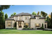 Two-story house with brick exterior, gabled roof and landscaping at 9125 Overlook Crest Dr, Wake Forest, NC 27587