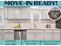 Modern kitchen features granite countertops and stainless steel appliances at 1003 W Anderson St, Selma, NC 27576