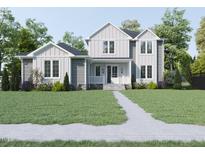 Two-story house with gray and white siding, landscaping, and walkway at 183 Lookout Rdg, Pittsboro, NC 27312