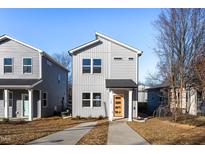 Modern two-story home with gray siding and orange door at 110-A S Hyde Park Ave, Durham, NC 27703