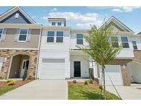 Charming townhouse with white siding, a one-car garage, and manicured front lawn at 43 Honeydew Way, Clayton, NC 27520