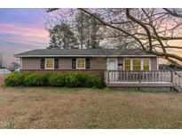 Charming single-story home with a cozy front porch and well-maintained landscaping at 507 W C St, Erwin, NC 28339