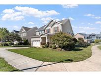 Charming two-story home with manicured lawn and attached two car garage at 2526 Snowdrop Ct, Apex, NC 27502
