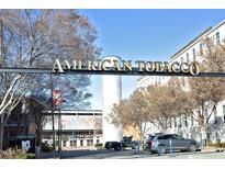 American Tobacco Campus entrance featuring a sign with gold lettering and various shops and buildings at 600 S Duke St # 26, Durham, NC 27701