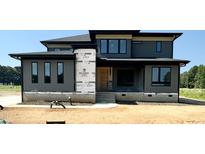 Modern two-story home with gray siding and black trim at 130 Broadleaf Ln, Youngsville, NC 27596