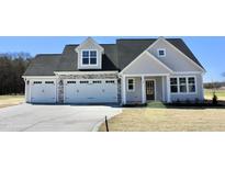 Beautiful two-story home with a three-car garage and stone accents at 48 Surles Landing Way, Benson, NC 27504