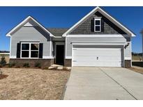 Charming single-Gathering home featuring a two-car garage and neutral color scheme at 17 E Victory View Ter, Smithfield, NC 27577