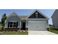 Charming single Gathering home featuring two-car garage and manicured lawn at 17 E Victory View Ter, Smithfield, NC 27577