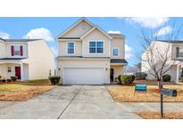 Two-story house with attached garage and landscaping at 2019 Tennessee Rd, Durham, NC 27704