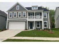 Charming two-story home with gray siding, white trim, covered porch, and a well-maintained lawn at 310 N Maple Walk # 236, Garner, NC 27529