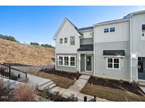 Beautiful new construction townhome with modern gray siding and a welcoming front entrance at 600 Hillfarm Dr, Wake Forest, NC 27587