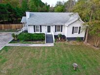 Charming one-story house with a well-maintained lawn and a spacious yard at 1924 Edgeleaf Dr, Willow Springs, NC 27592