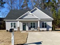 Charming one-story house with gray siding and a welcoming front porch at 26 Wildberry Ct, Rocky Mount, NC 27804