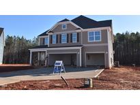 Two-story home with gray siding, white trim, and a two-car garage at 70 Accord Dr, Youngsville, NC 27596