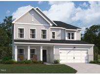 Two-story home with gray siding, a covered porch, and a two-car garage at 100 S Stonemill Trl # Homesite 234, Clayton, NC 27520