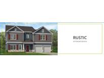 Charming two-story home with a two-car garage, brick accents and beautiful landscaping at 308 Whispering Way, Sanford, NC 27330